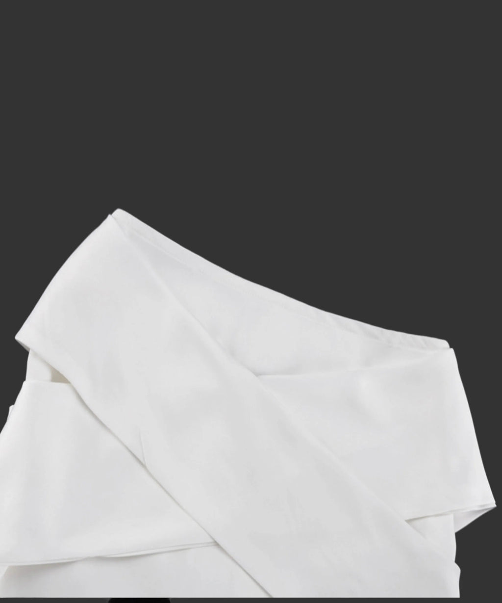 White fabric draped over a black background