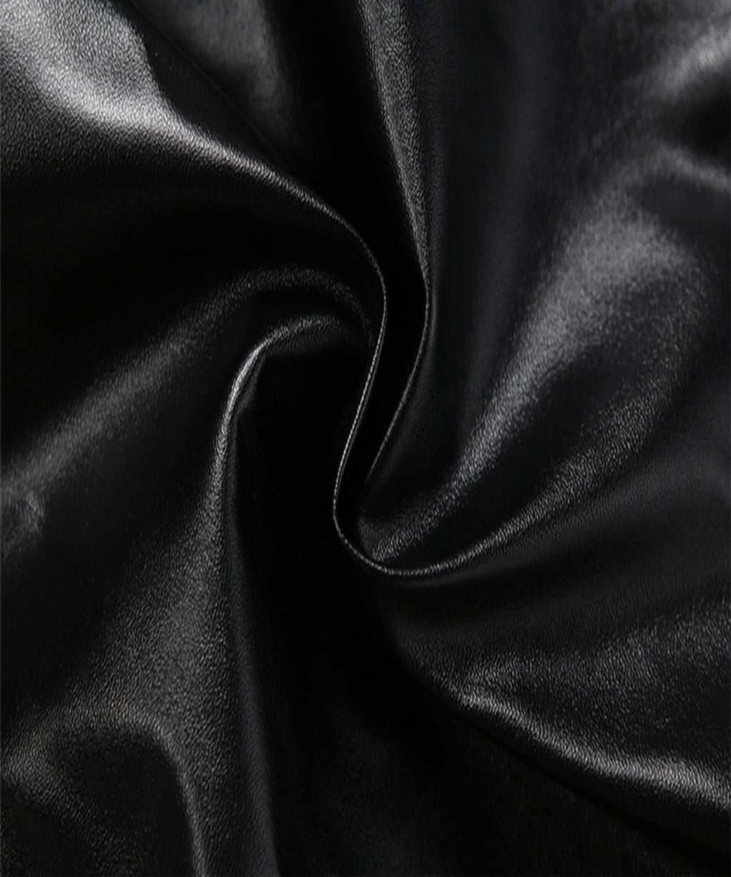 Close-up of black satin fabric with folds