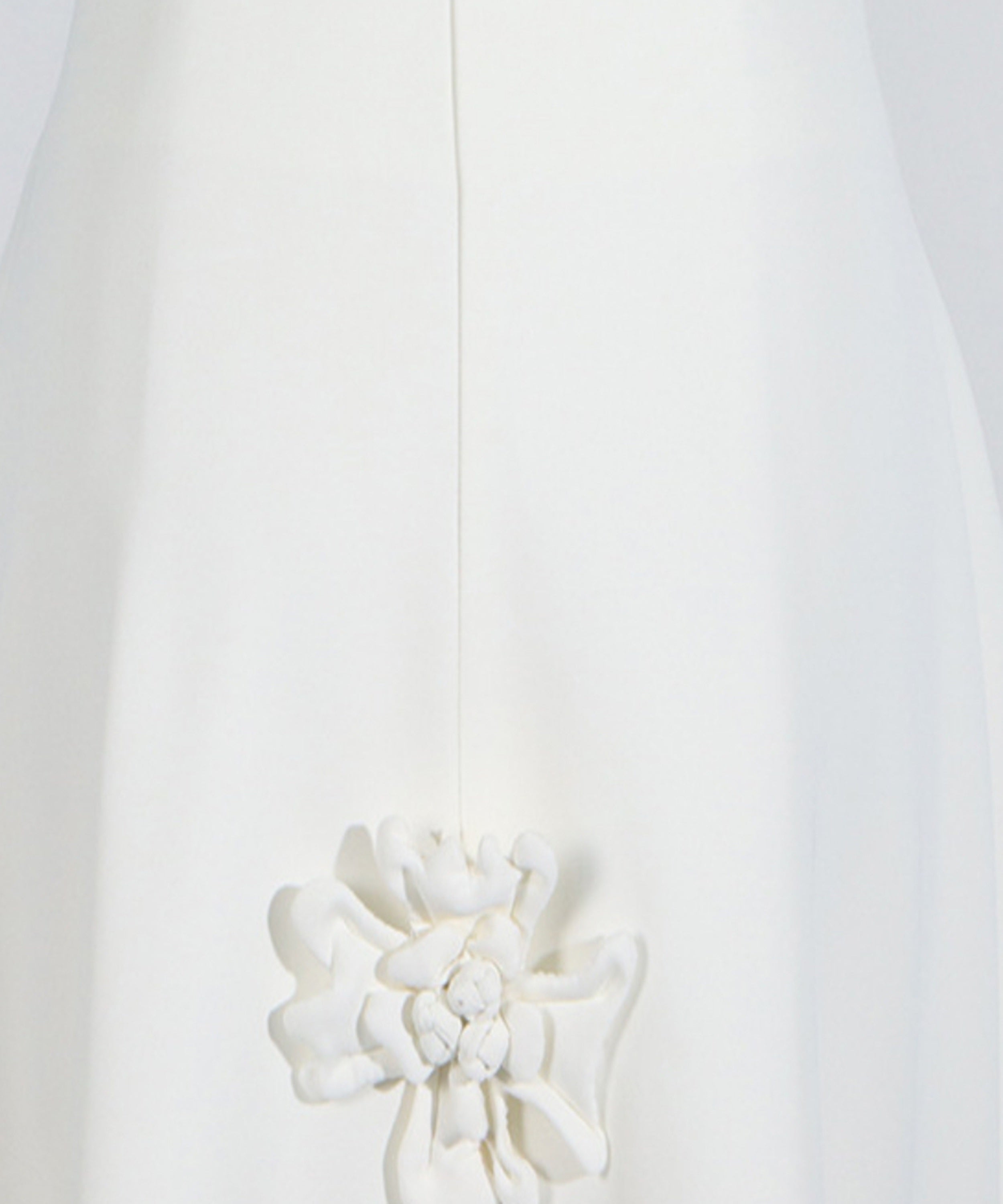 White floral brooch on a white background