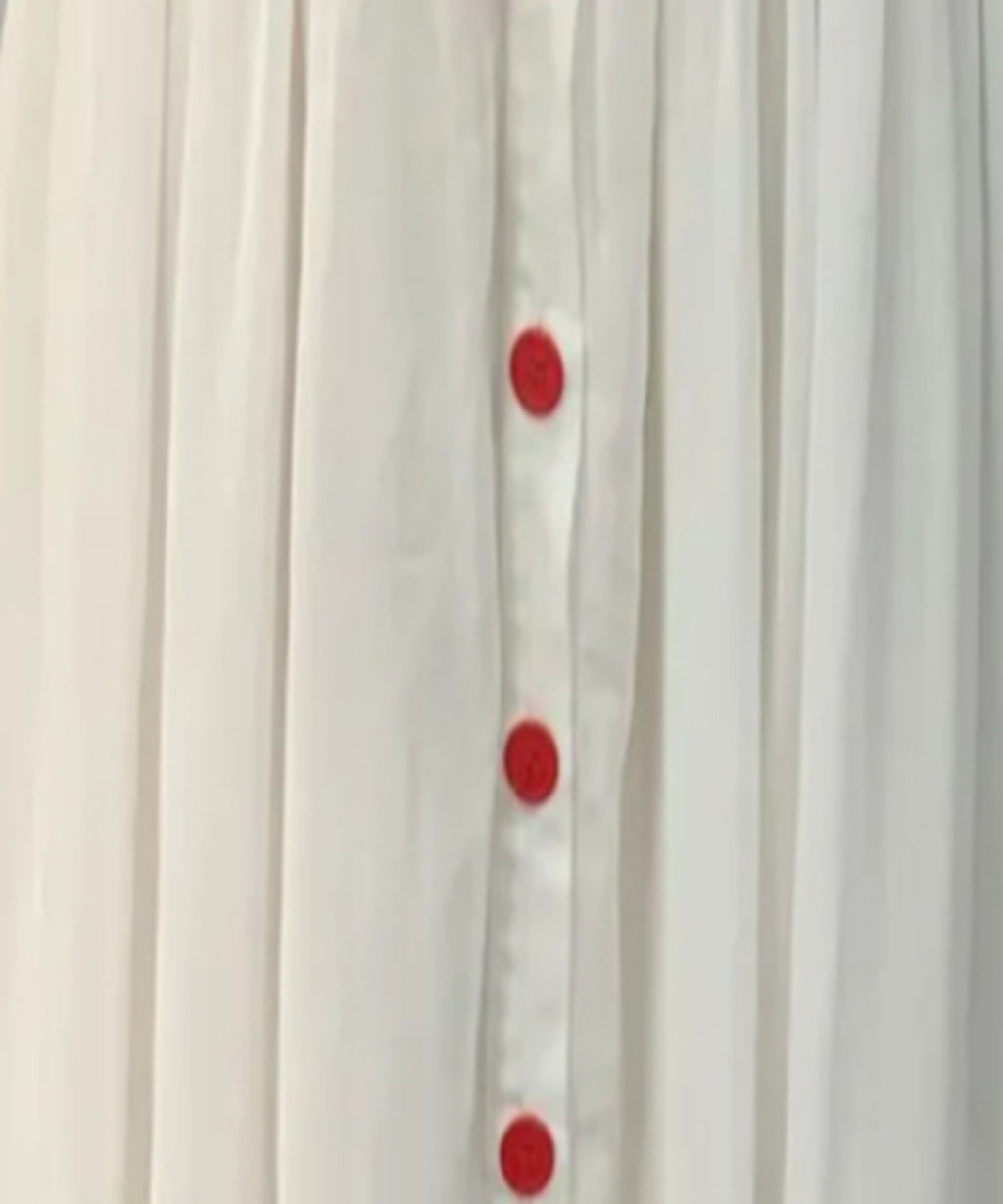 White curtain with red polka dots