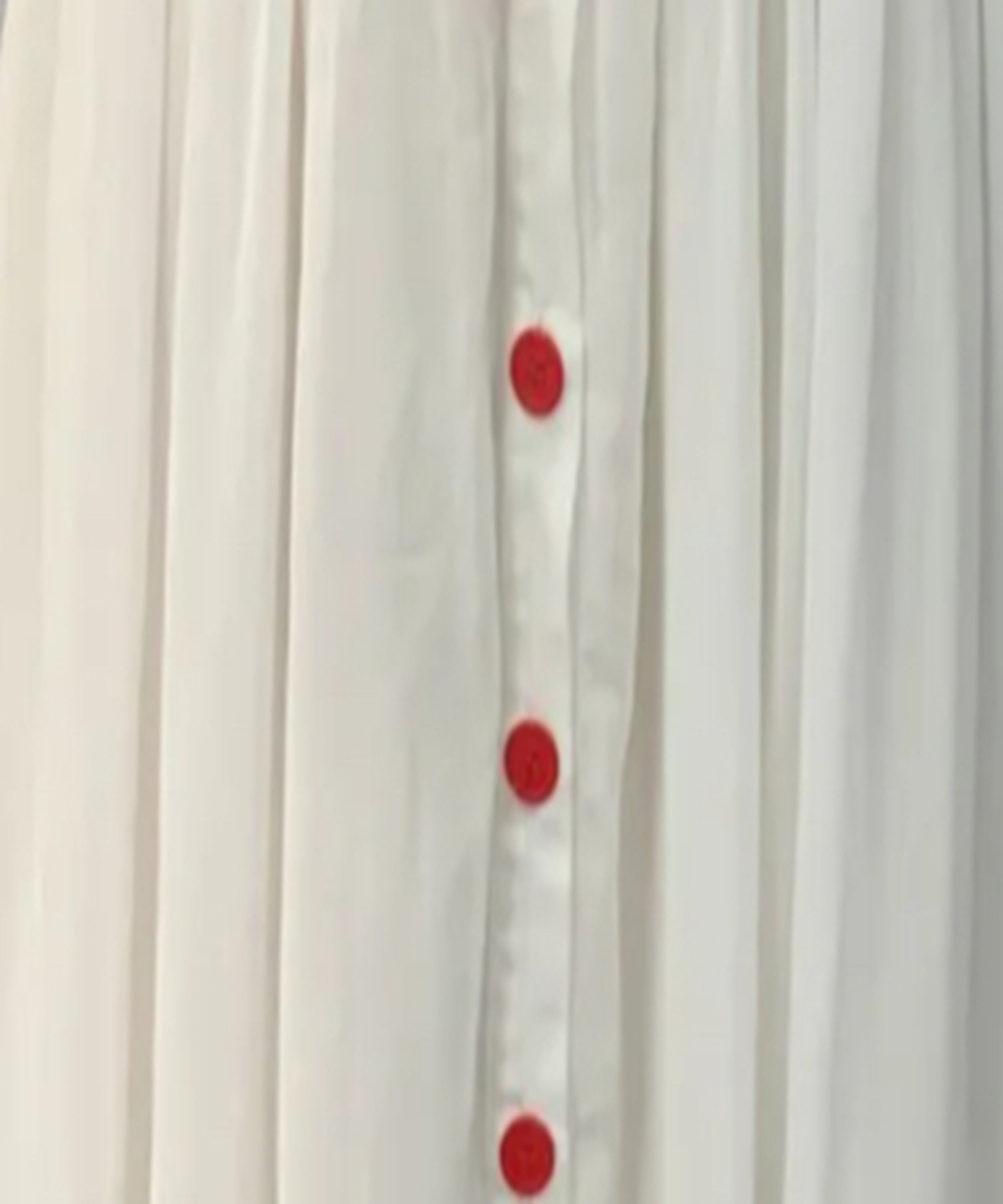 White curtain with red polka dots