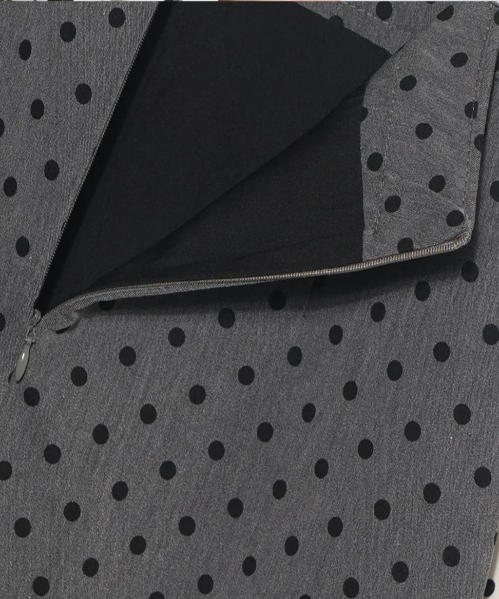 Gray fabric with black polka dots and a zipper