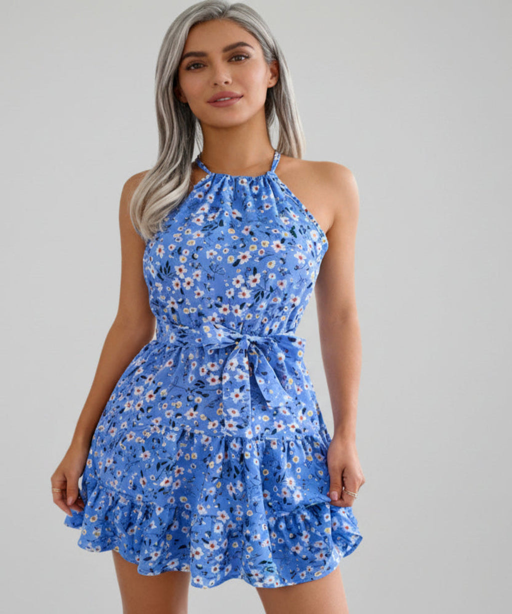 Woman wearing a blue floral dress on a white background
