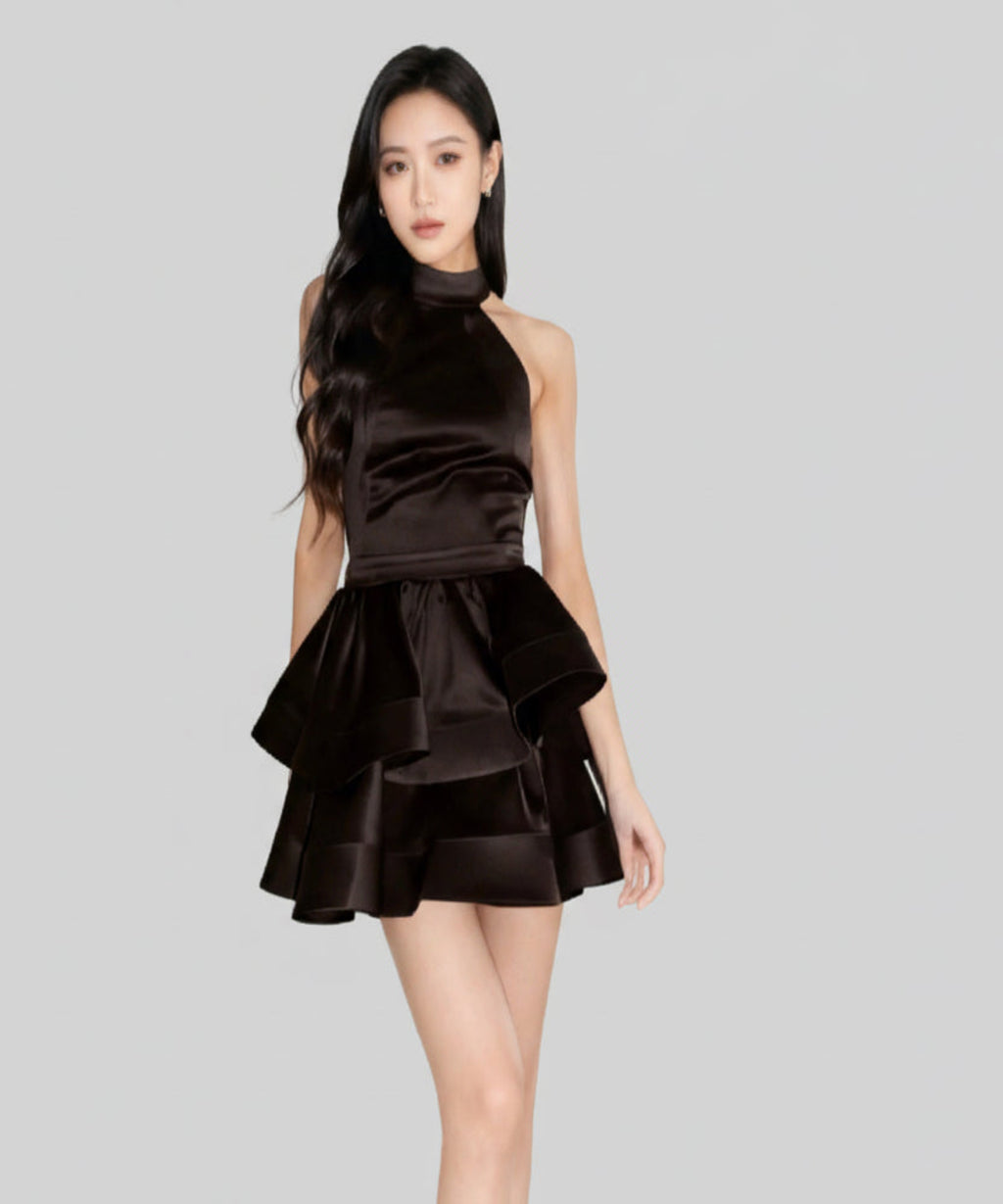 Woman wearing a black dress on a white background