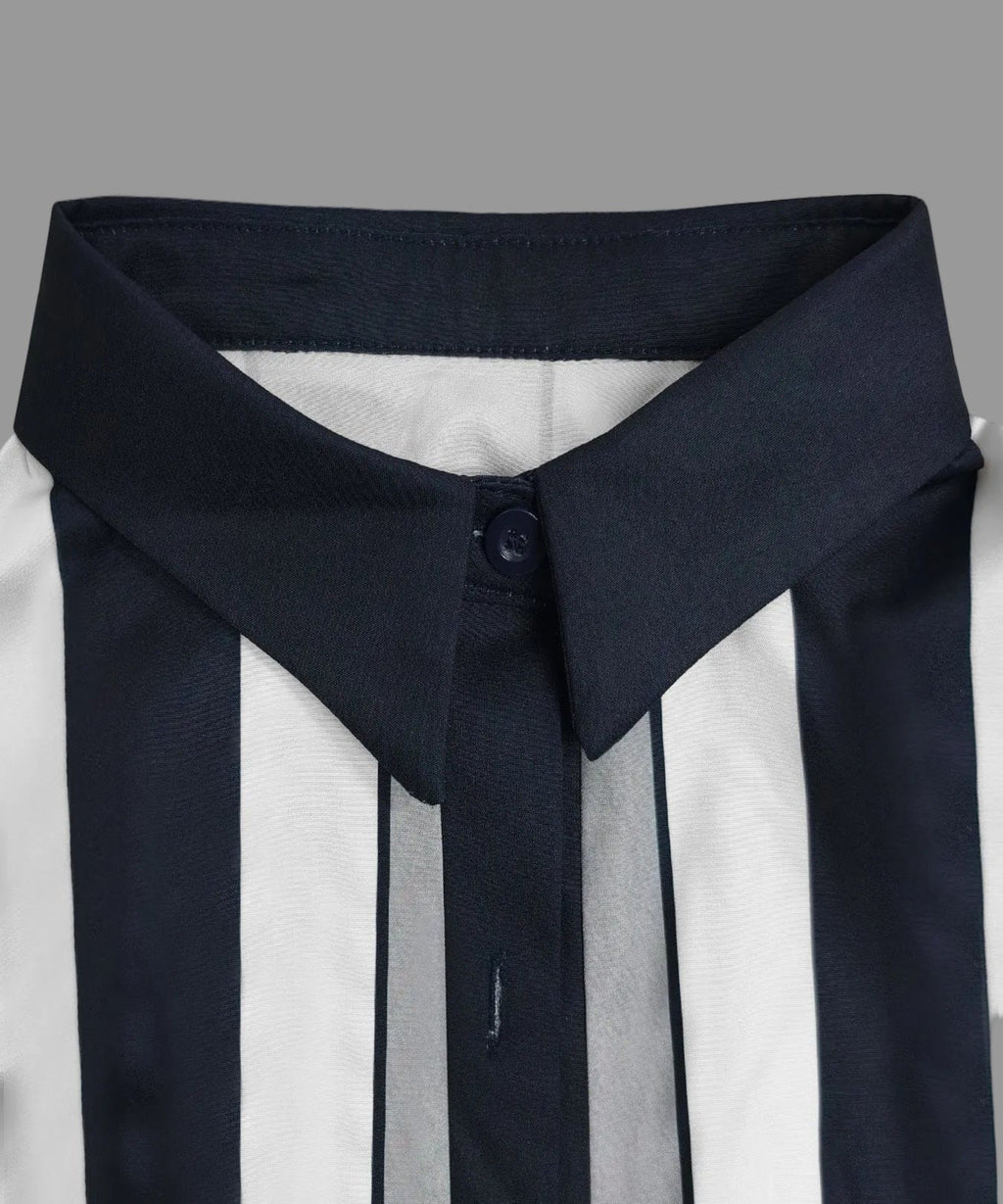 Close-up of a navy blue and white striped shirt with a high collar on a light gray background