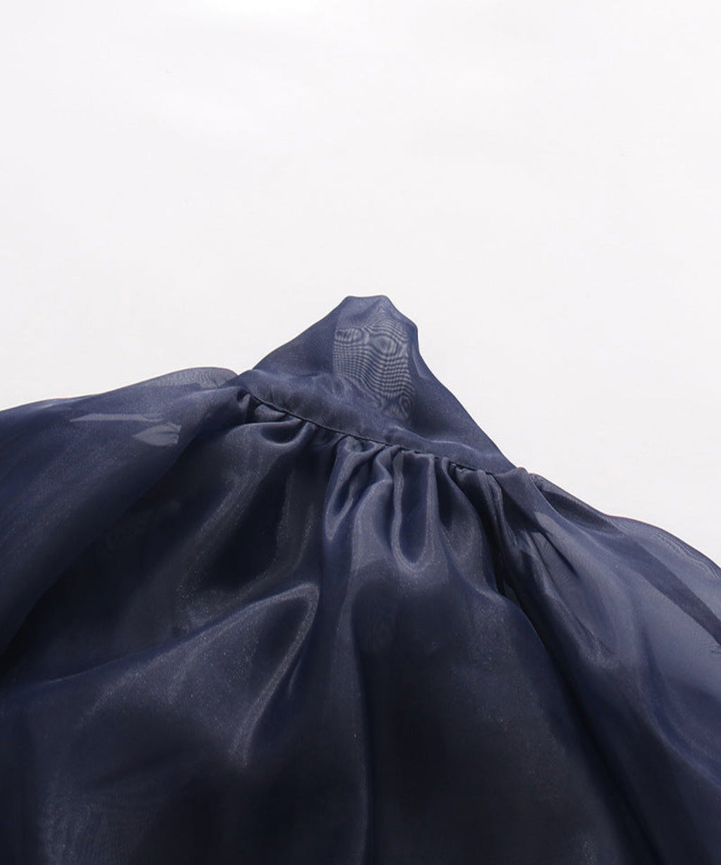 Navy blue skirt with a brand logo on a light gray background